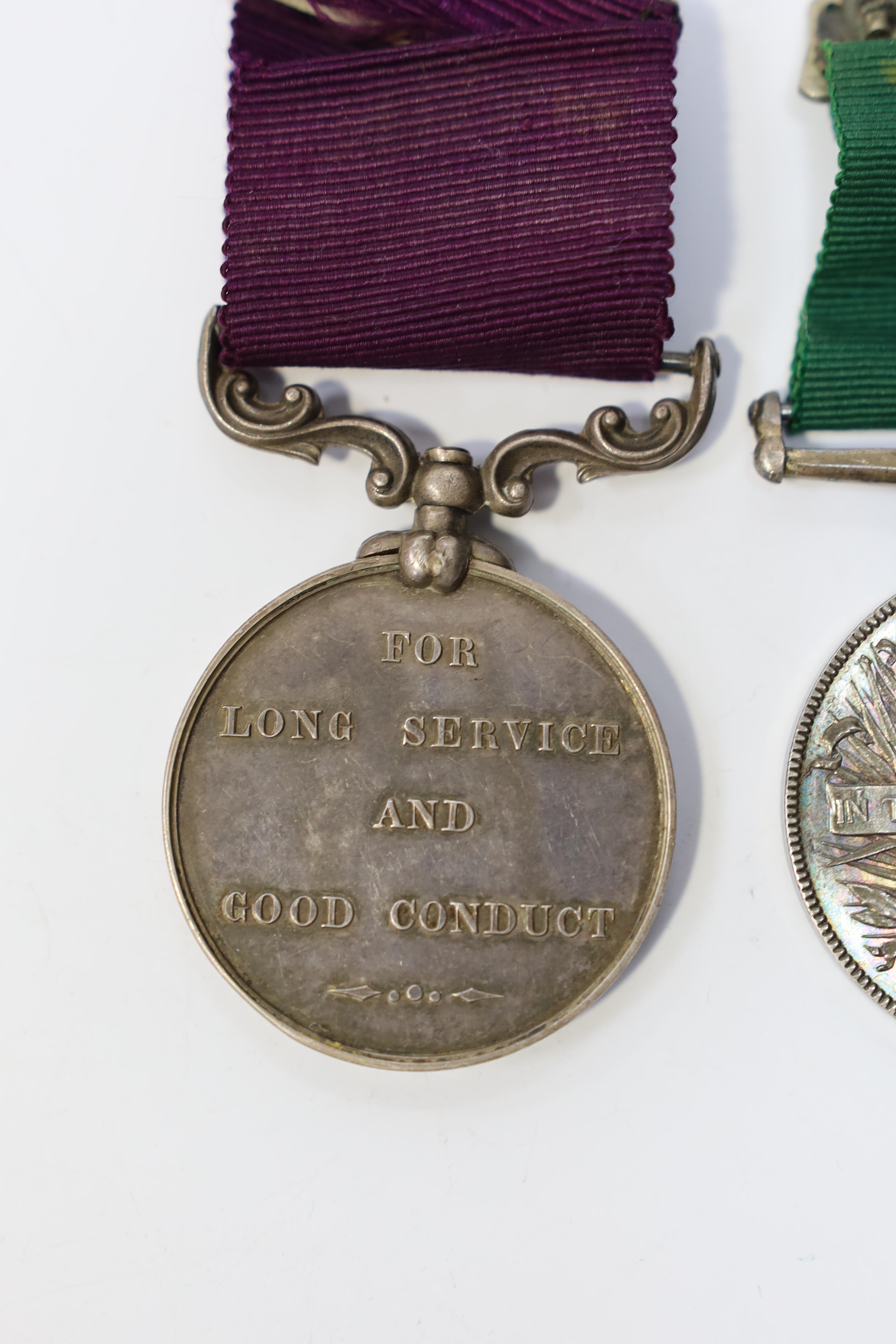 A Victorian LSGC medal to 1843 C:Sgt J.Cook. Gord. High'rs. and an unnamed Victorian Volunteer Long Service medal. Condition - fair